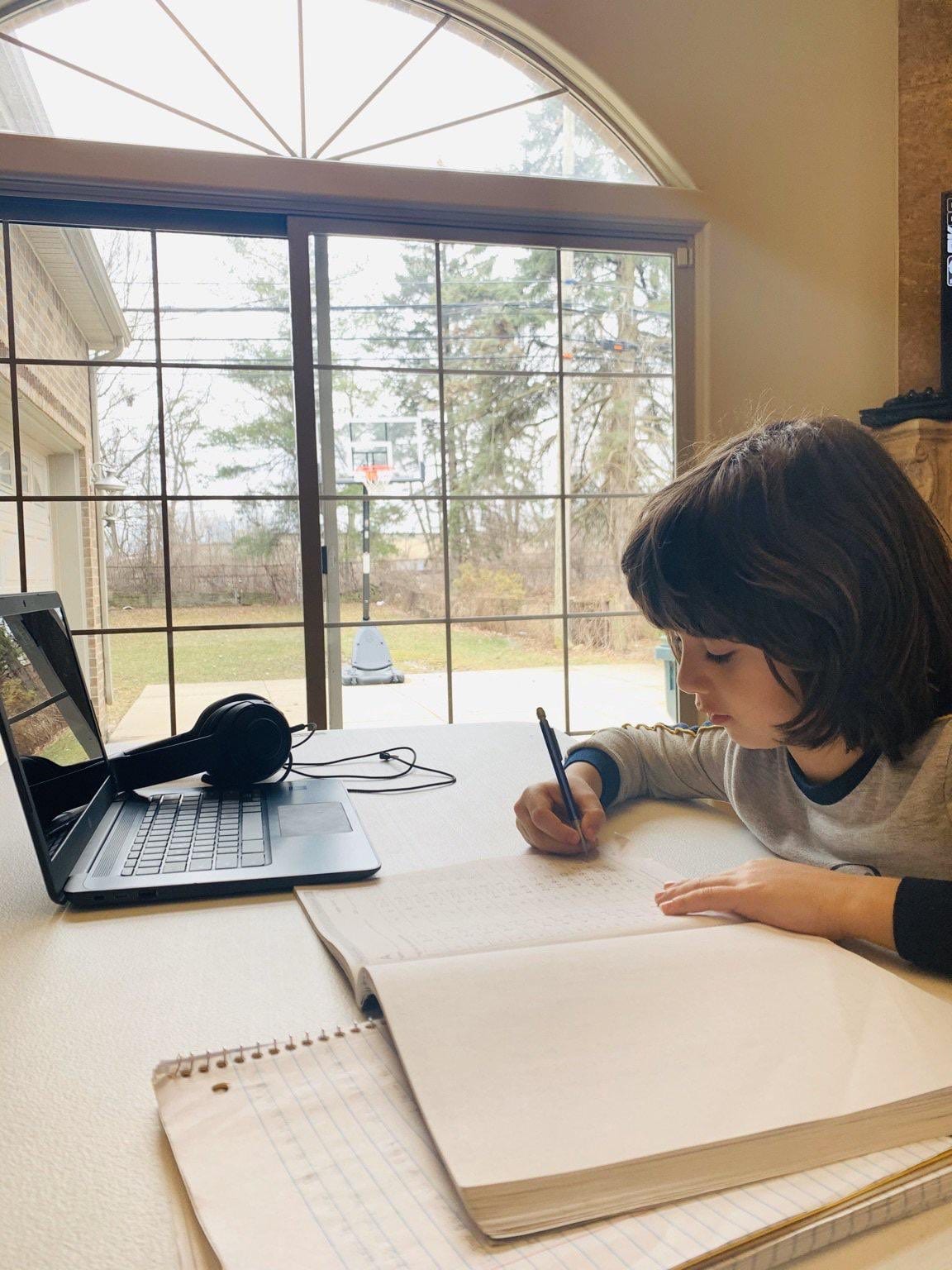 A Dearborn Public School student works from home in the spring of 2020.