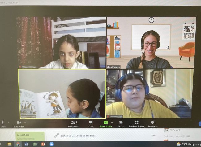 Screen shot of a teacher and three students during an online lesson.