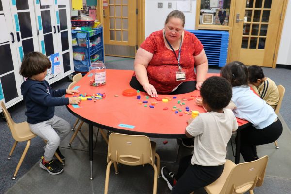 A teacher works with a group of students in the Strong Beginnings 3-year-old preschool in the fall of 2022.