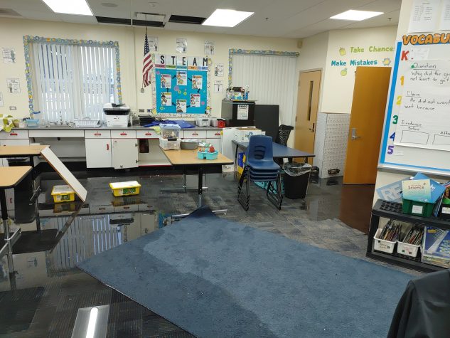 Water covers most of a classroom floor at Miller Elementary School in December 2022.