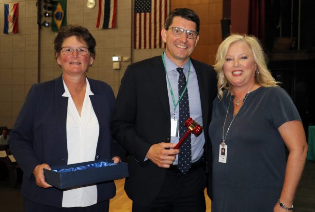 Dearborn Superintendent Glenn Maleyko, center, is presented with a gavel on Monday, June 19, 2023, as he prepares to begin his term as president of the Michigan Association of Superintendents and Administrators. Also pictured are MASA Executive Director Dr. Tina Kerr, left, and outgoing MASA President Angie McArthur, Superintendent of the Eastern Upper Peninsula Intermediate School District.