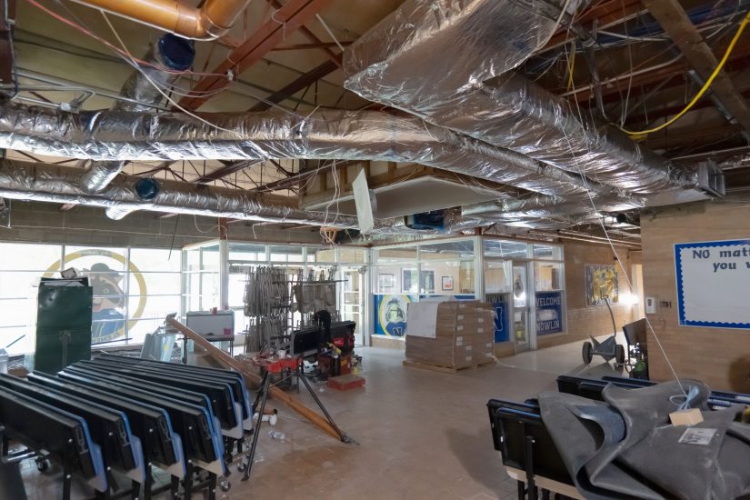 An exposed ceiling in the lobby of Nowlin Elementary shows a tangle of duct work and other infrastructure during summer 2024 construction