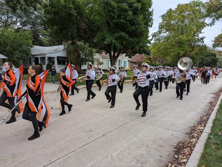 The Dearborn High Marching Band performs in the schools 2023 Homecoming parade.