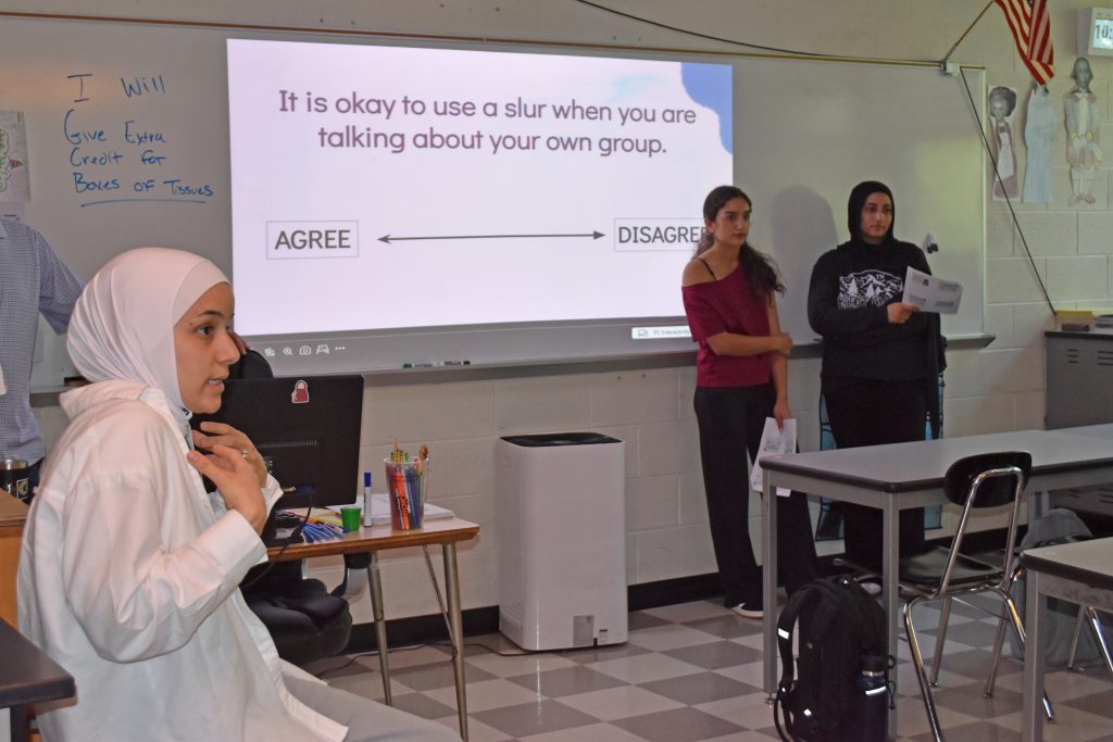 Zanib Sareini talks to students during a Language Matters presentation at Edsel Ford High.