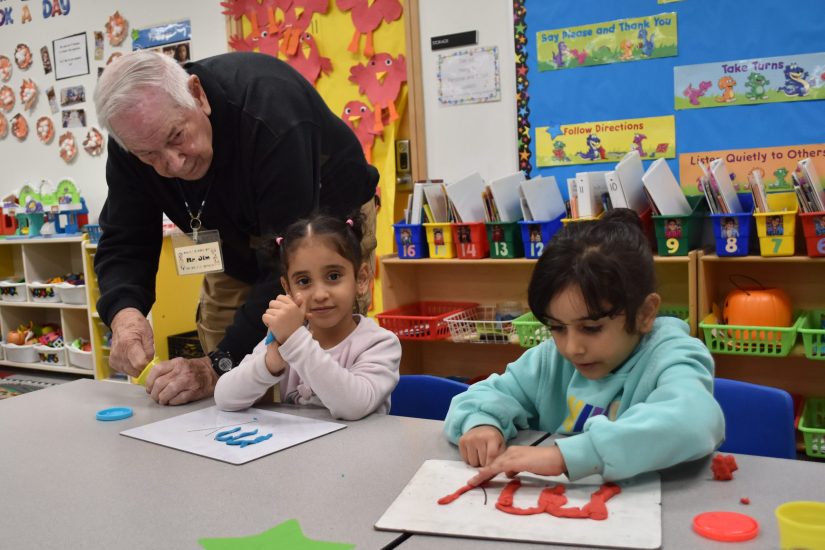Mr Jim with playdough James Martin, also known as Mr. Jim, helps Salina students use playdough to write the word "my."