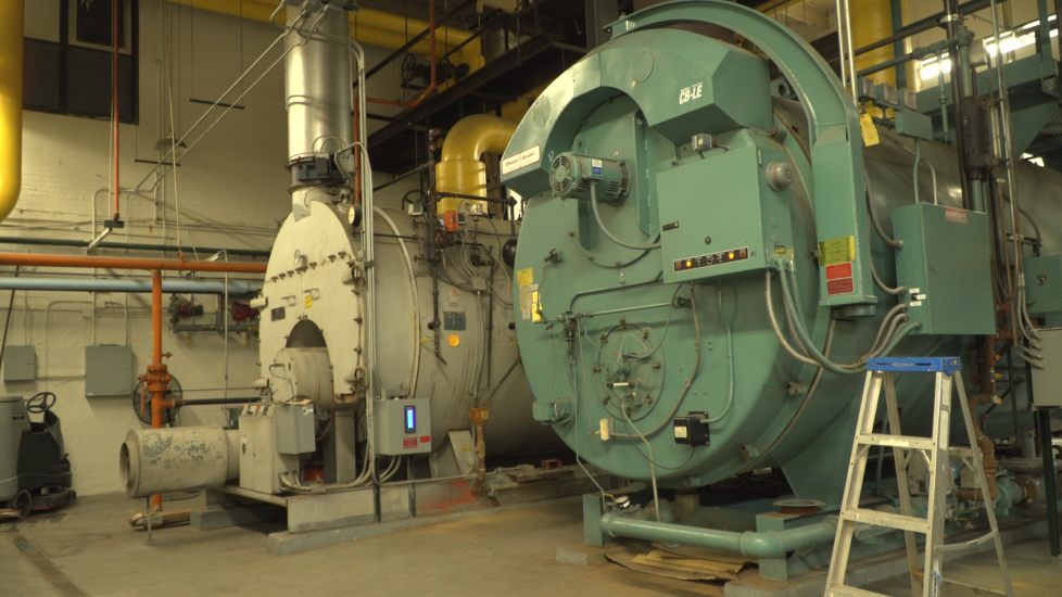 Lowrey boiler in 2022 Two old boilers in the basement of Lowrey School. Photo from 2022.