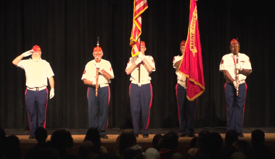 Veterans do a flag presentation on stage