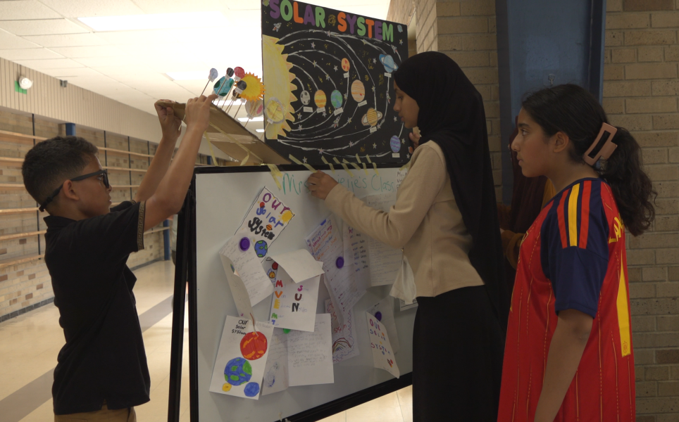 Mrs Hoejeis’s Class Board Setup Students prepare a display about the solar system.