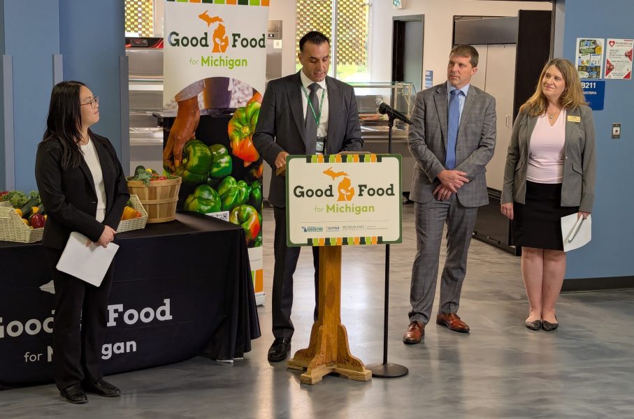 Superintendent Mike Esseily speaks at the Good Foods for Michigan press conference while other speakers look on