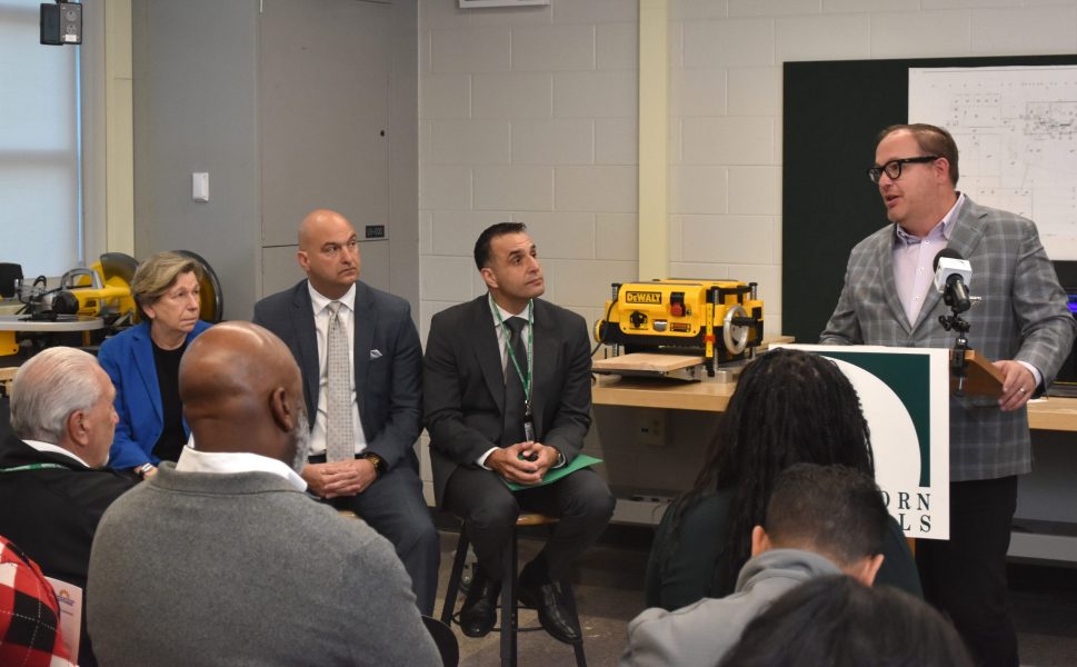 MBCC press release General Motors Vice President of Infrastructure and Corporate Citizenship David Massaron speaks while AFT President Randi Weingarten, Detroit Public Schools Community District Superintendent Nikolai Vitti, and Dearborn Public Schools Superintendent Mike Esseily look on.